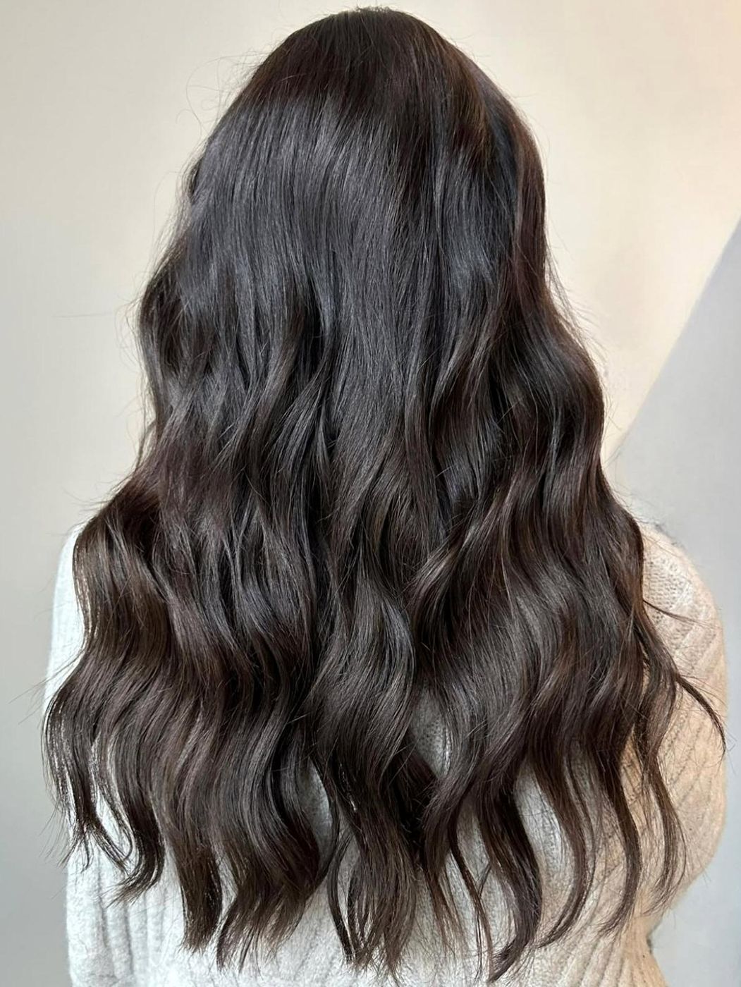 Glossy brunette waves, styled finish